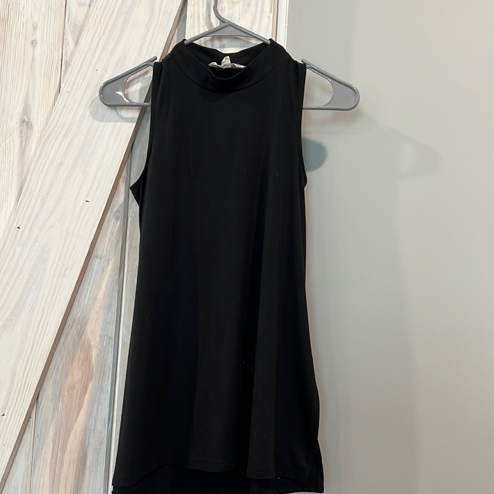Sleeveless tunic style mock neck